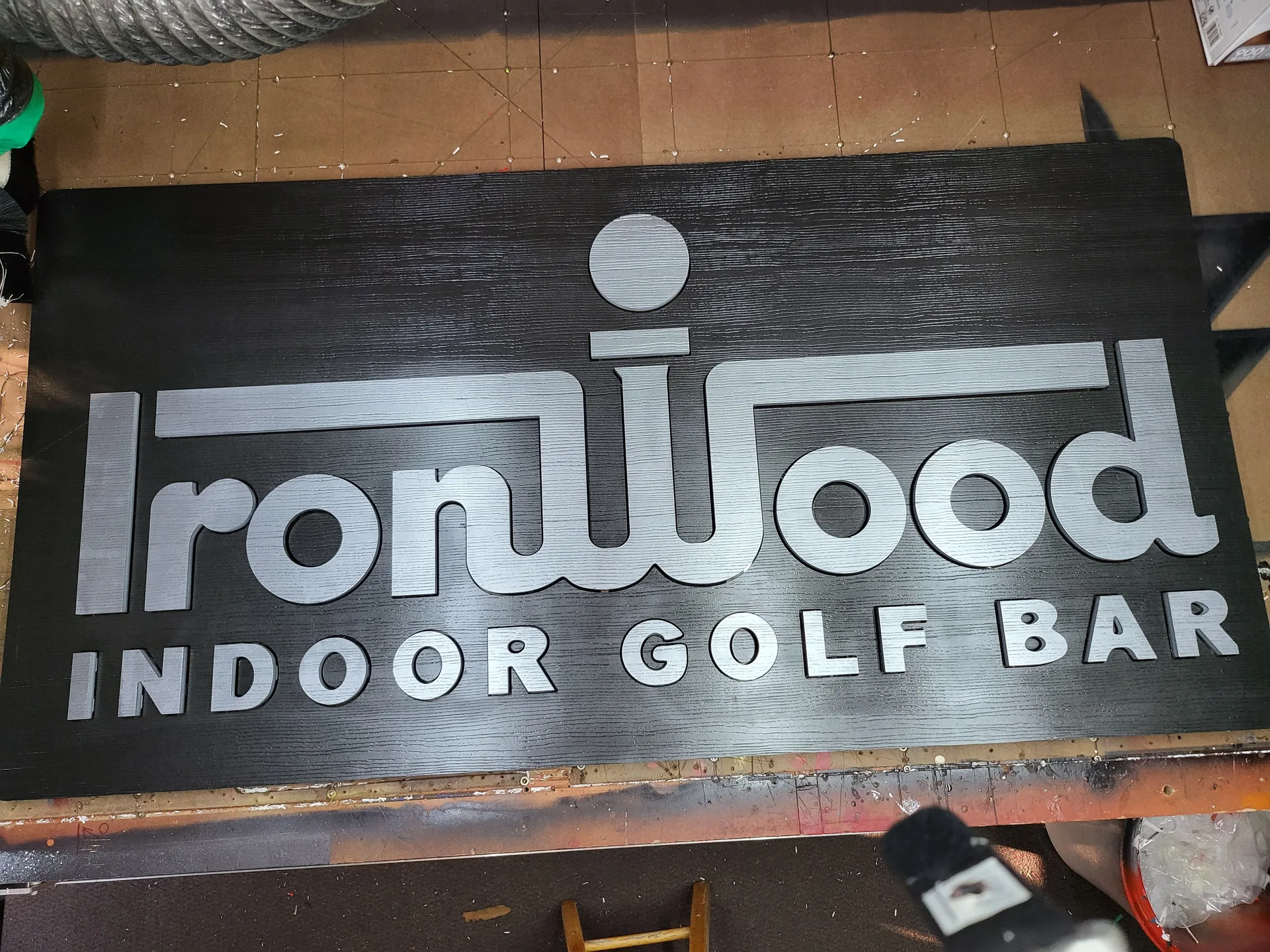 3D sign IronWood Indoor Golf Bar daylight