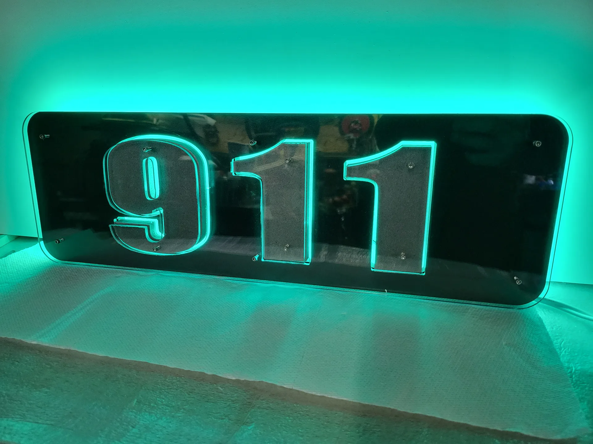 Backlit address sign 911 green