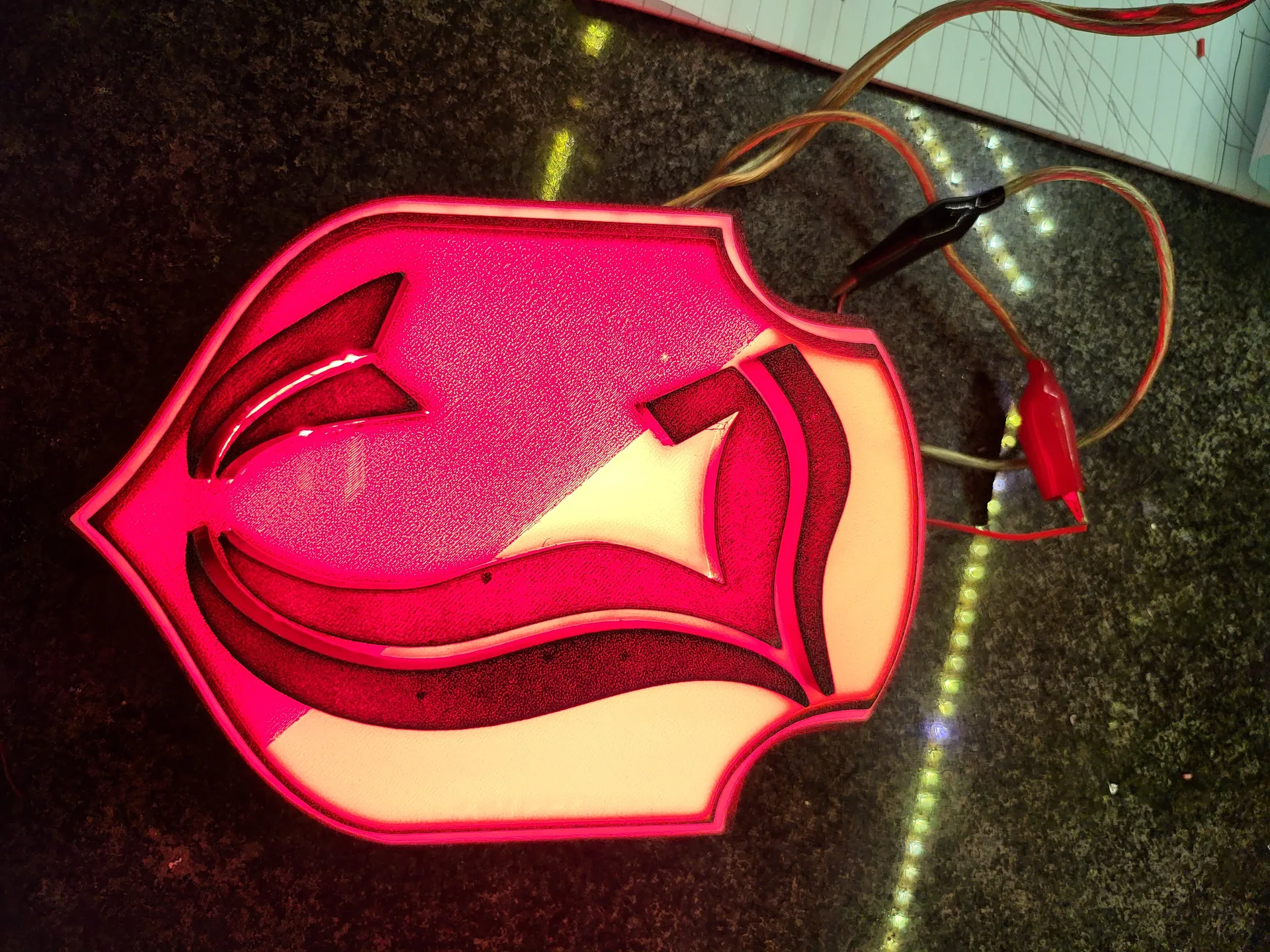 Layered emblem backlit scorpion crest