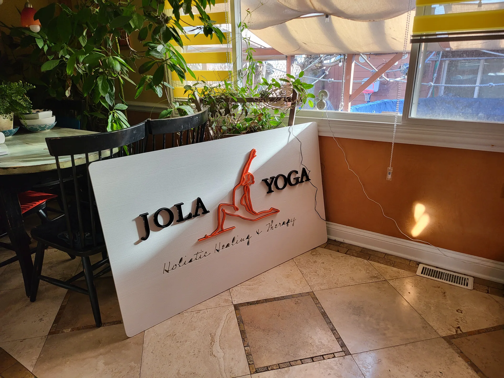 Installed sign Jola Yoga reception